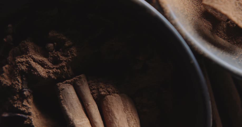 Powdered cinnamon fills two bowls