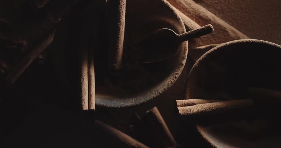 Cinnamon sticks and bowls on a countertop