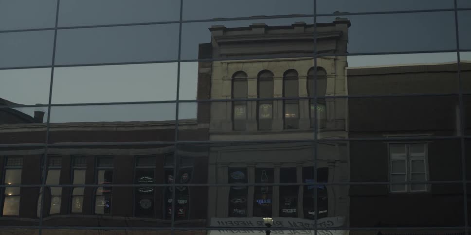 A building reflected in the glass of another building