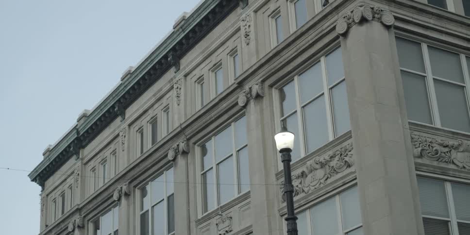 A lamppost in front of a building