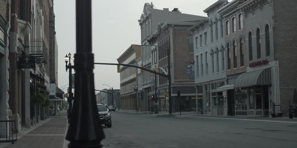 A town street is empty on a cloudy day
