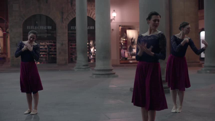 Three dancers dance a lyrical trio in shopping area