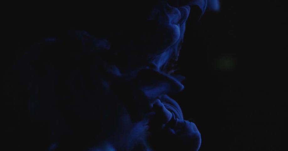 Blue smoke across the screen with a globe of the earth rolling through it