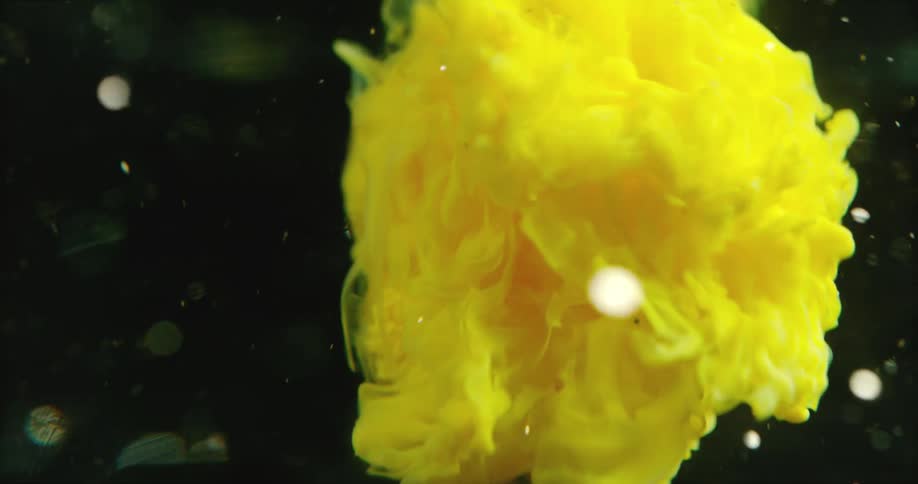 The yellow cloud spins underwater