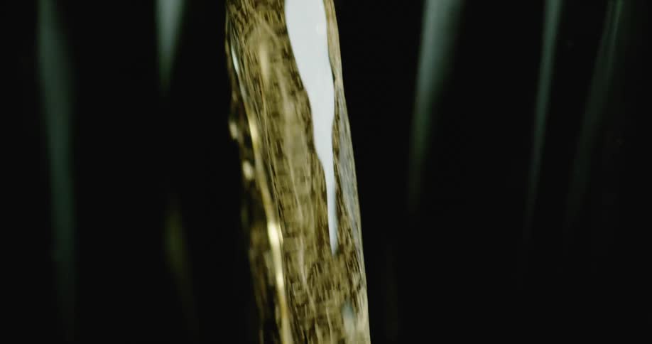 Beer is being poured into a glass