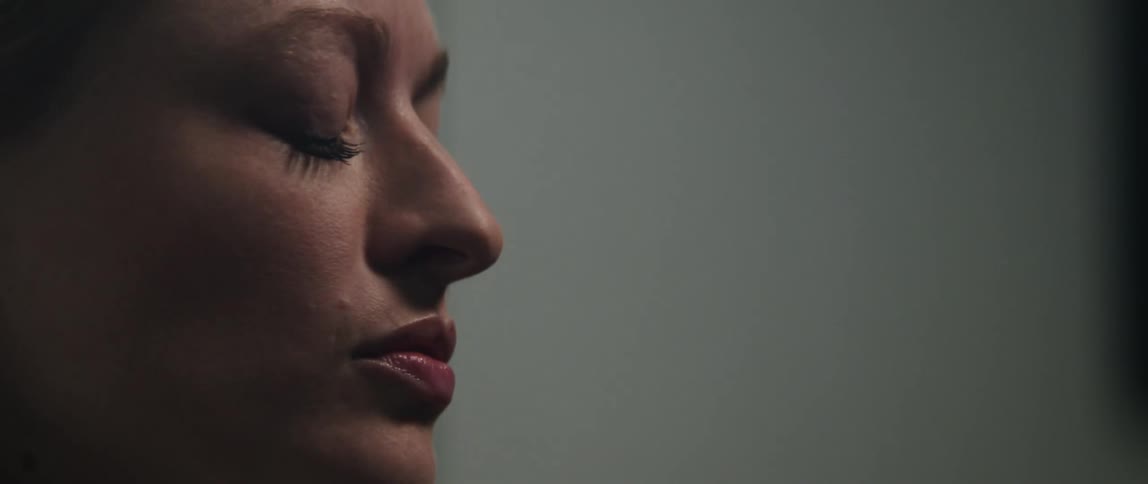 A woman singing in a room