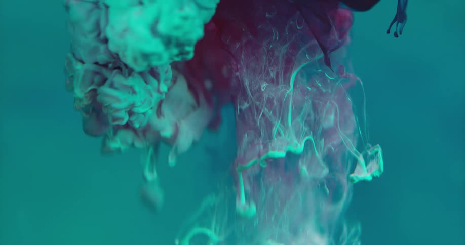Colorful swirling liquid suspended in water