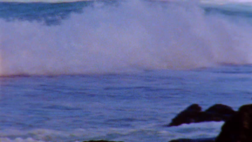 Ocean waves are crashing fast towards the coast