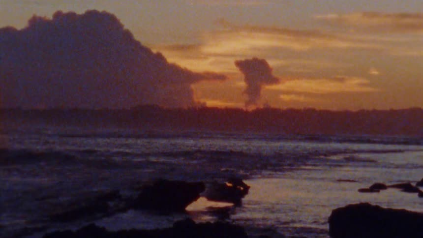 The sun is setting in the horizon of the ocean coast