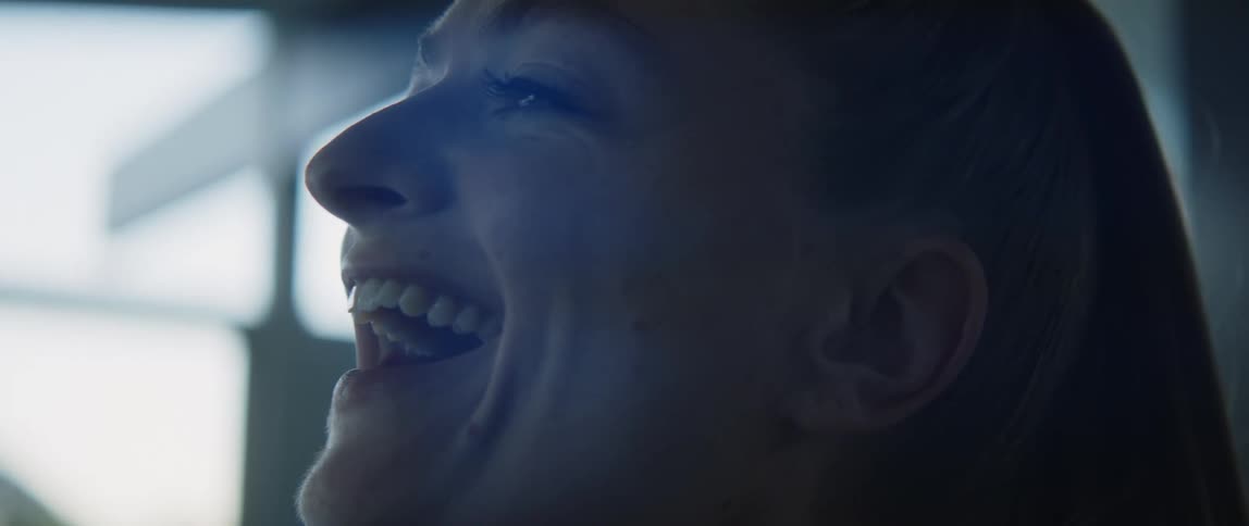 A woman is laughing in the room