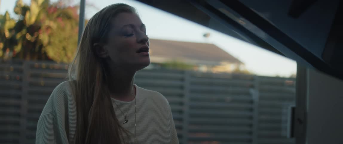 A woman is singing at home