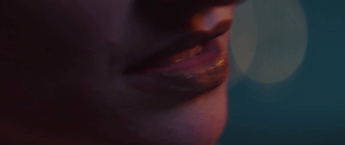 Woman wearing lipstick sings