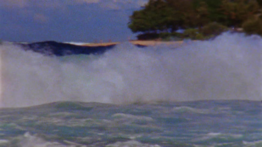 Ocean waves crashing over one another along the beach