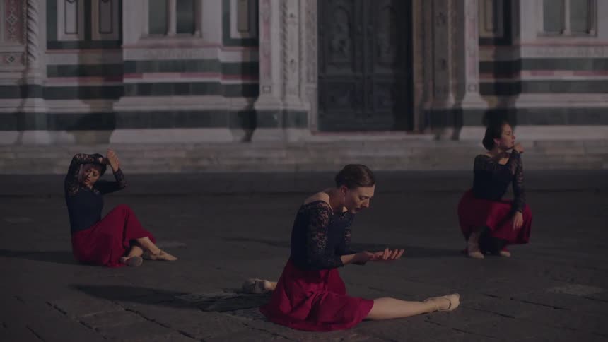 Three dancers begin a performance