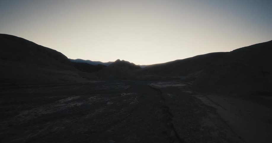 An aerial view of mountains in the dark
