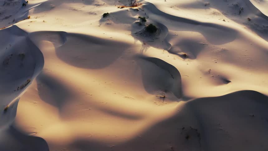 Aerial view of an arctic landscape at dusk is displayed