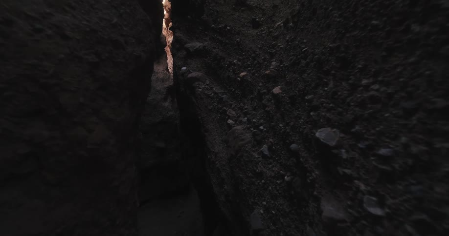A narrow crevice in a rock formation