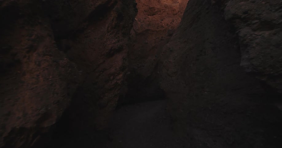 Narrow crevices on the floor of a canyon