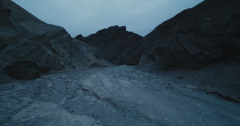 Walking through a canyon in the desert at morning