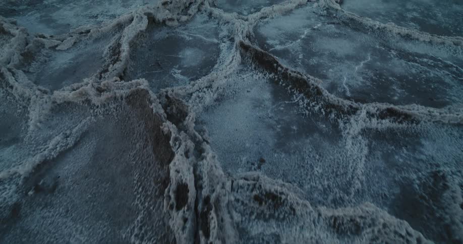 An aerial view of a desert with snow