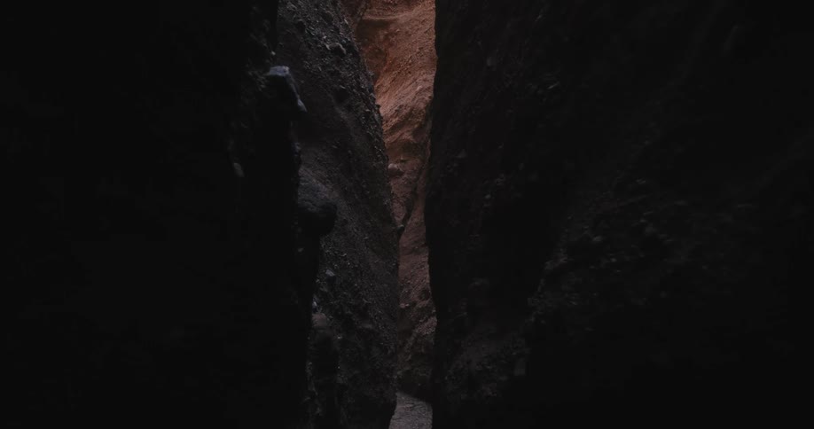 The narrow crevice of a canyon during the day