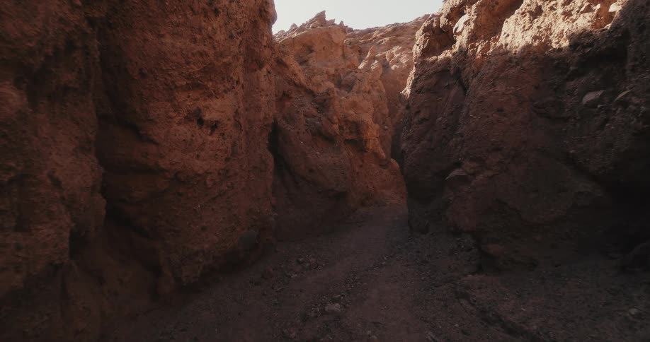 Land between two rock formations is displayed
