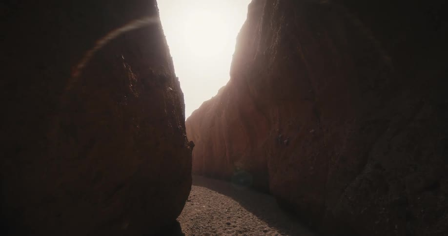 The floor of an arid canyon during the day