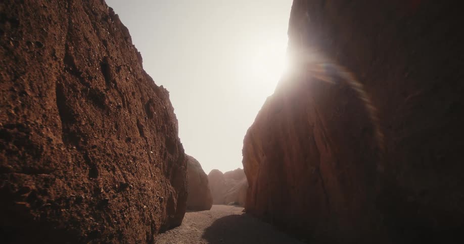 The floor of a narrow canyon during the day