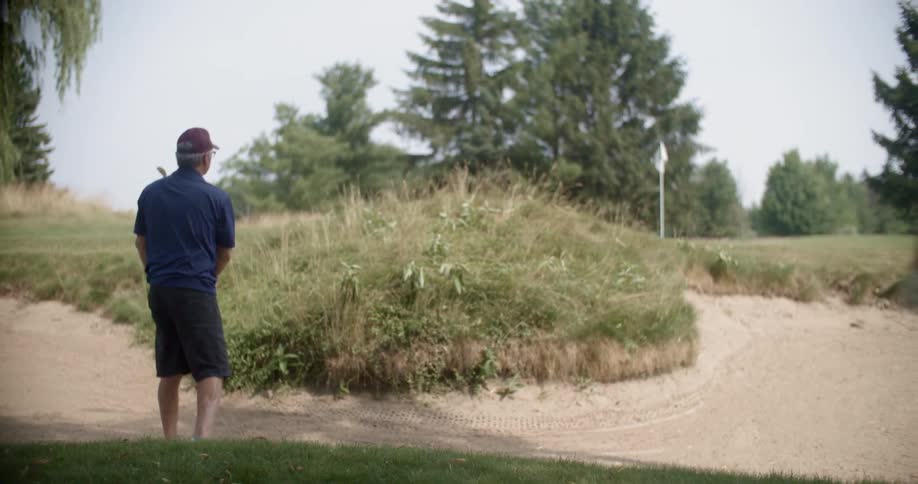 People are playing golf on a cloudy day