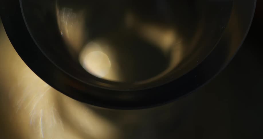 Close up of a creamy liquid slowly pouring
