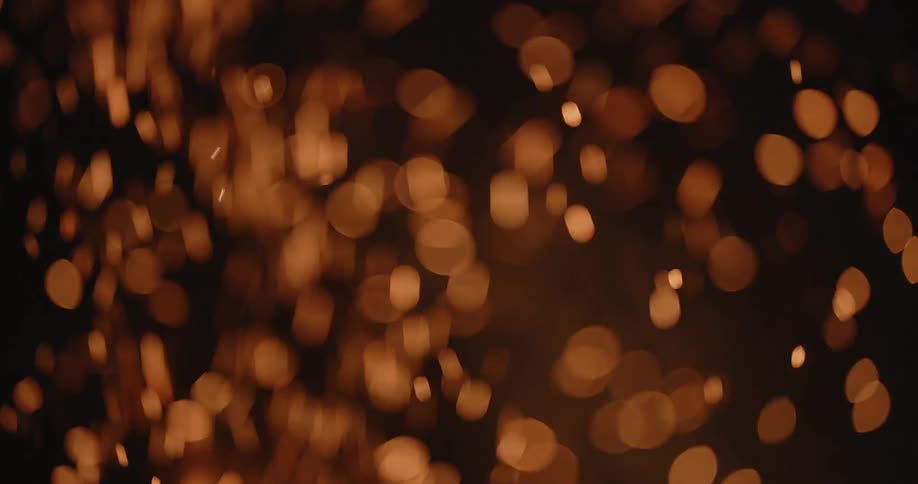 A flame sends smoke and embers into the air