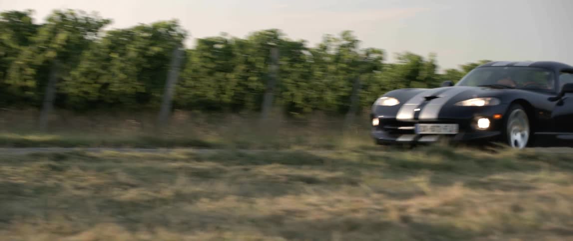 A car driving down a road outdoors