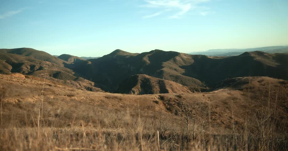 A countryside covered in hills and mountains during the day