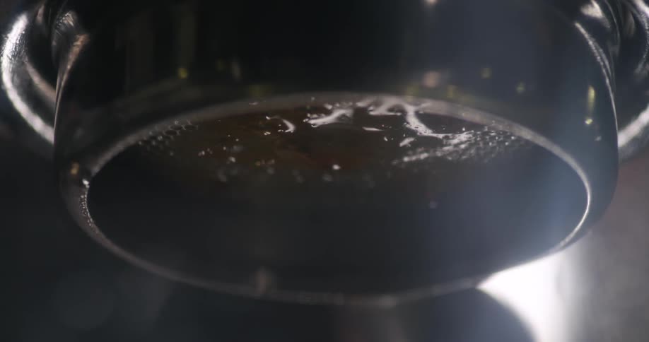 Close up of coffee brewing on an espresso machine
