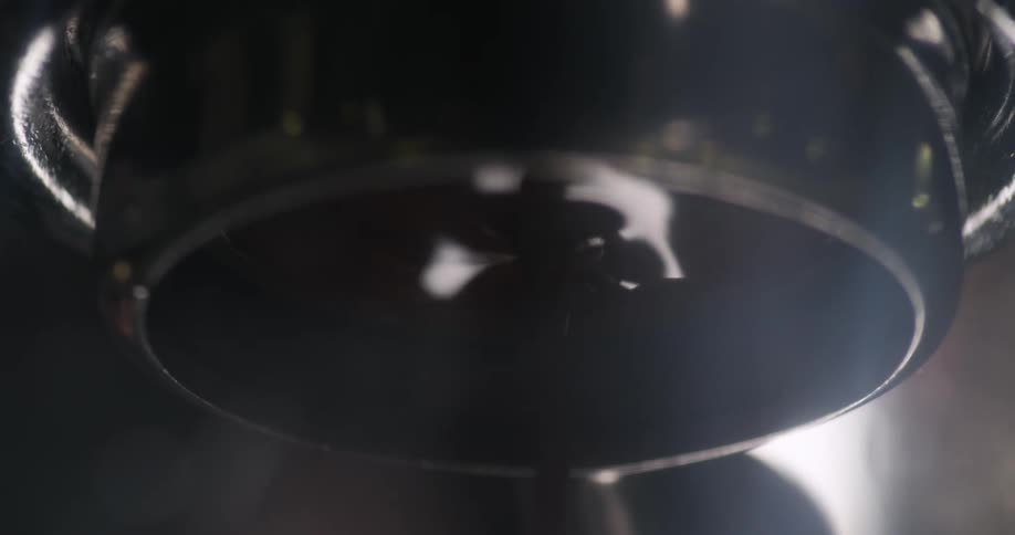 Coffee drips from a machine