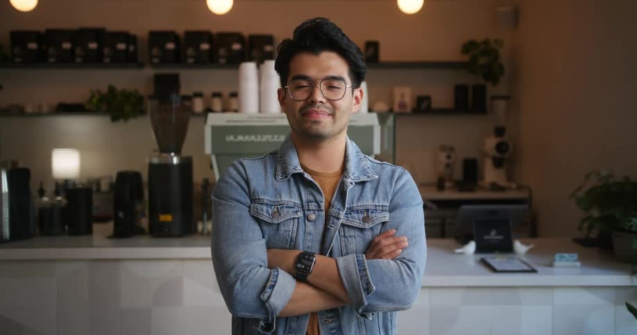 A cafe worker poses in the restaurant