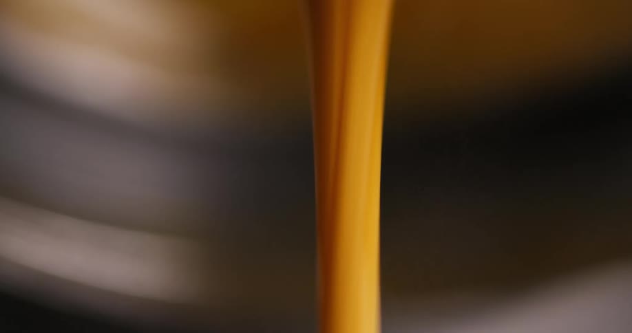 Orange liquid is being poured on the display
