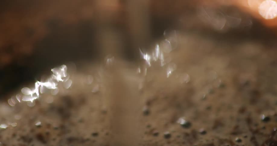 Hot water is poured on the coffee grounds