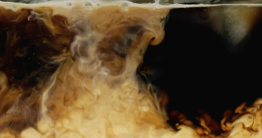 White liquid poured into black liquid