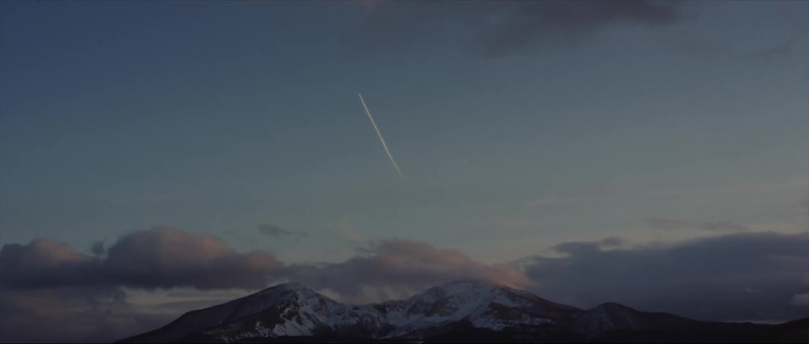 A snowy mountain peak near the clouds