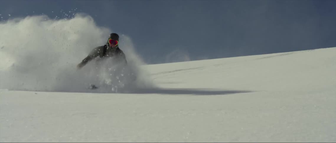 A skier skiing on snow