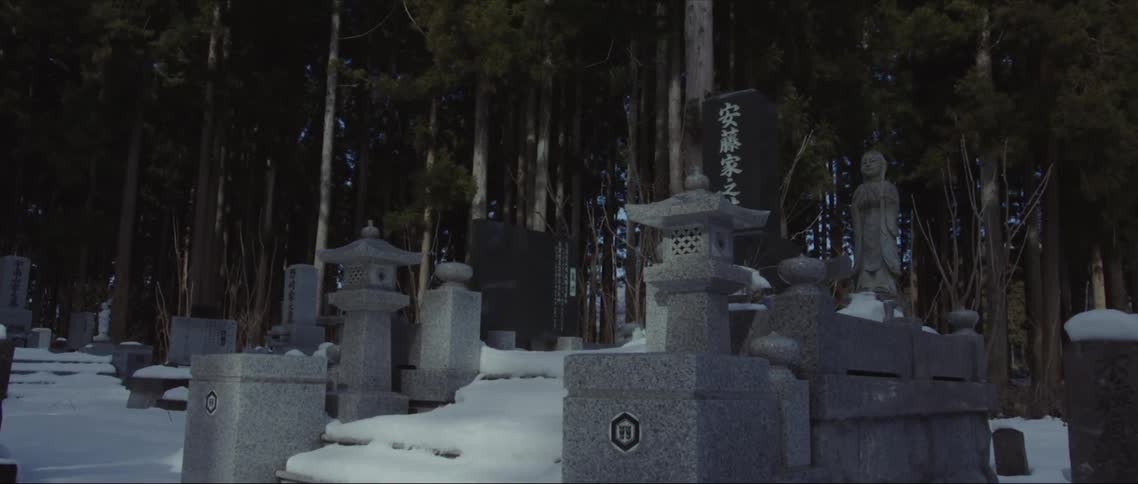 Snow covers area of monuments and statuary in graveyard