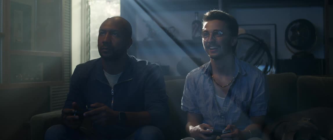 Two men are playing video games together