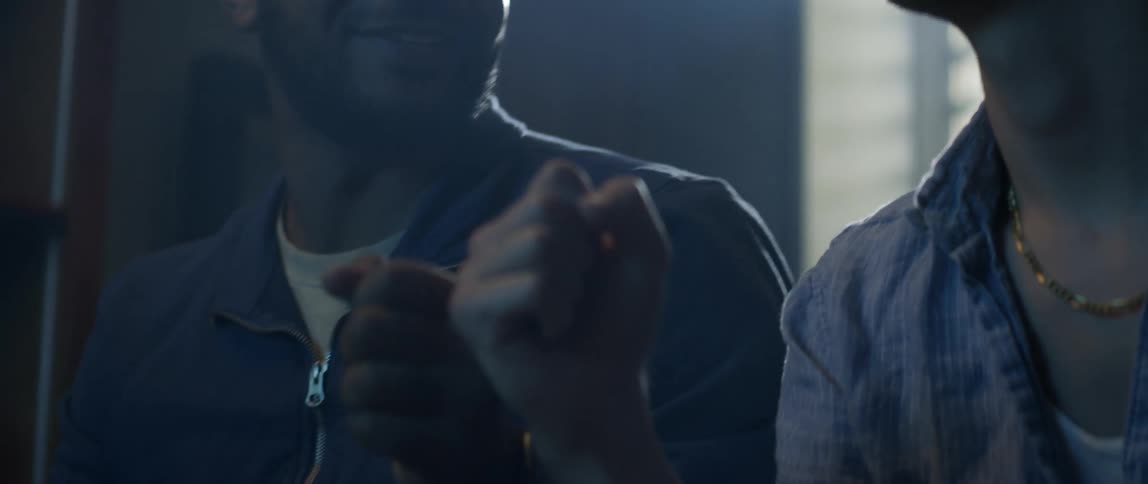 Two friends fist bump each other