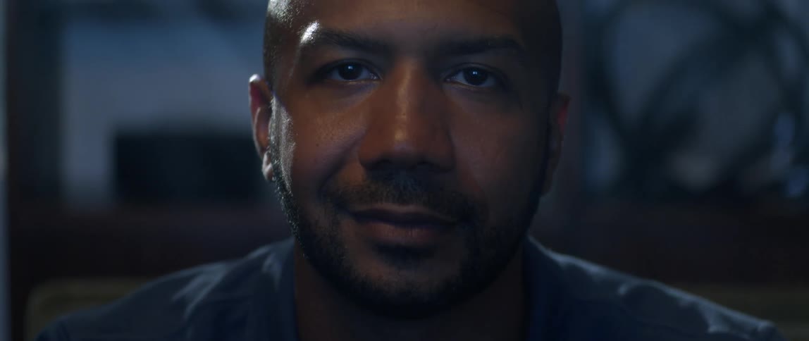 A man inside nods his head and smiles
