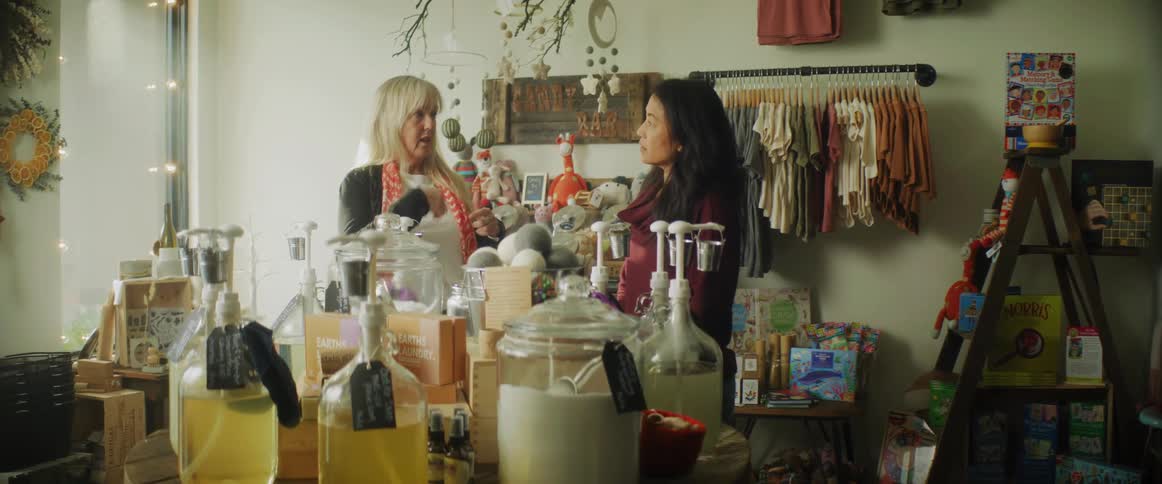 Customer talking to the employee on a small shop