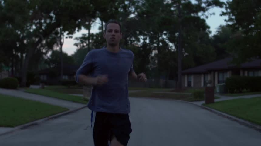 A man jogs down the road