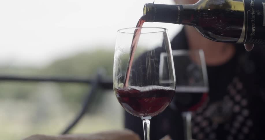 Wine being poured into glasses