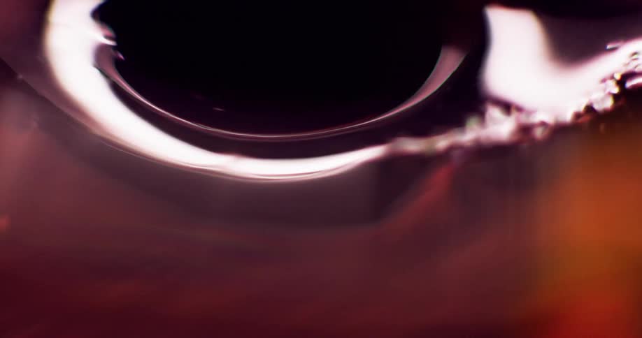 Water spins near vortex bubbling and rippling as it churns