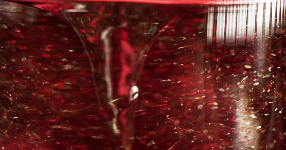 A swirling vortex of water and bubbles with flashing lights